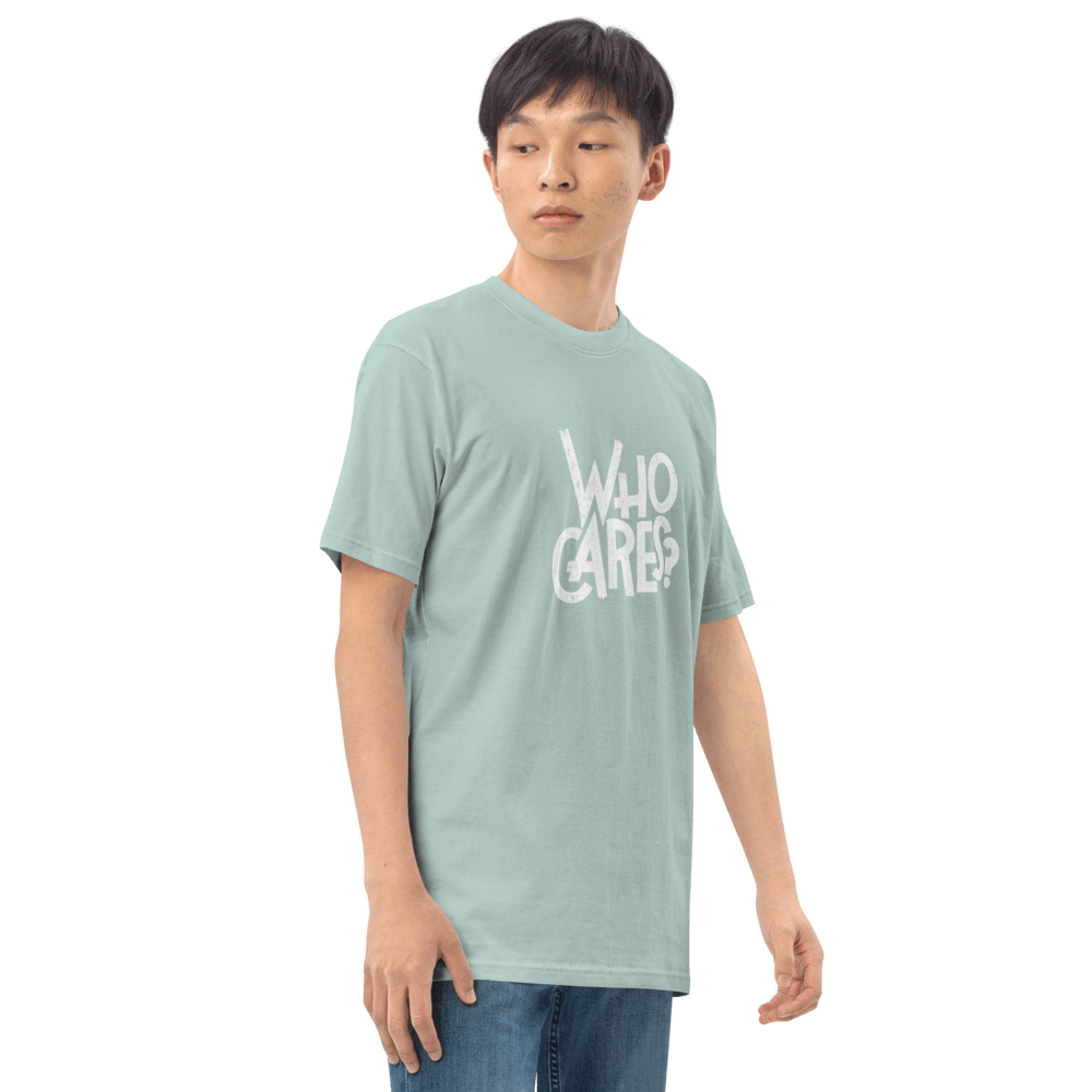 Trendy graphic tee in mint green featuring 'Who Cares?' print, ideal for casual outfits, made from organic cotton.