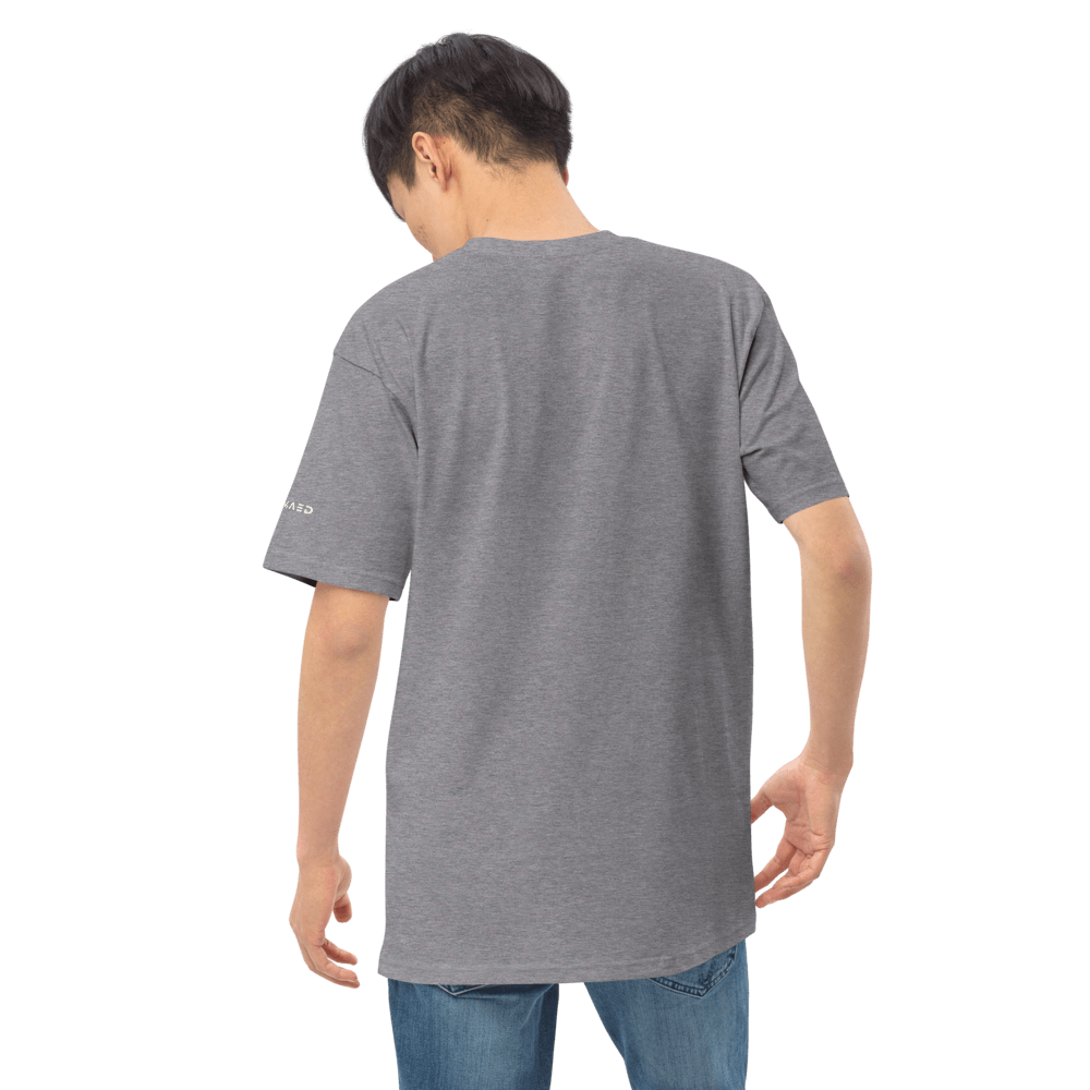 Back view of a model wearing an Essential Grey Tee made of 60% cotton and 40% polyester, showcasing its relaxed fit.