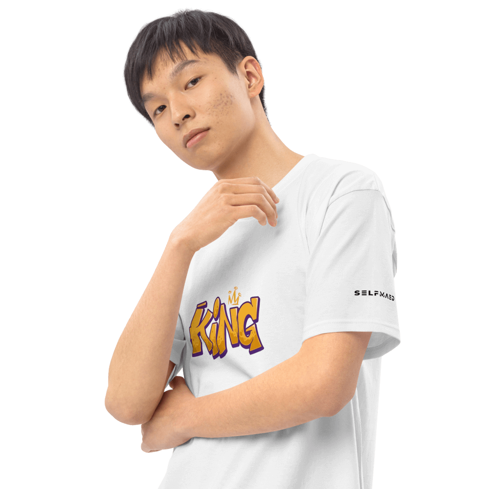 Model showcasing the Essential White King T-shirt, a premium organic cotton tee with a stylish graphic.