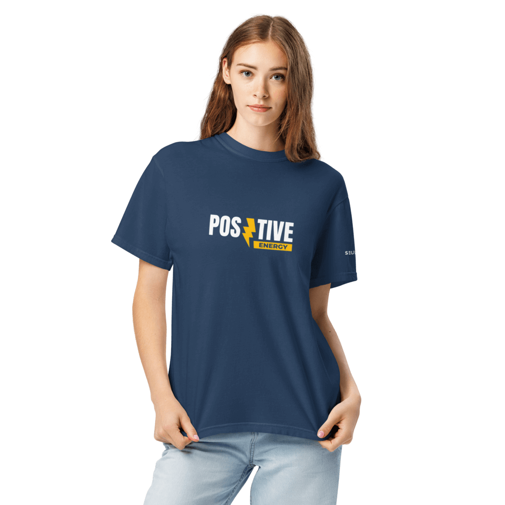 Model wearing Essential Positive Energy Tee in navy, showcasing a premium organic cotton unisex fit.