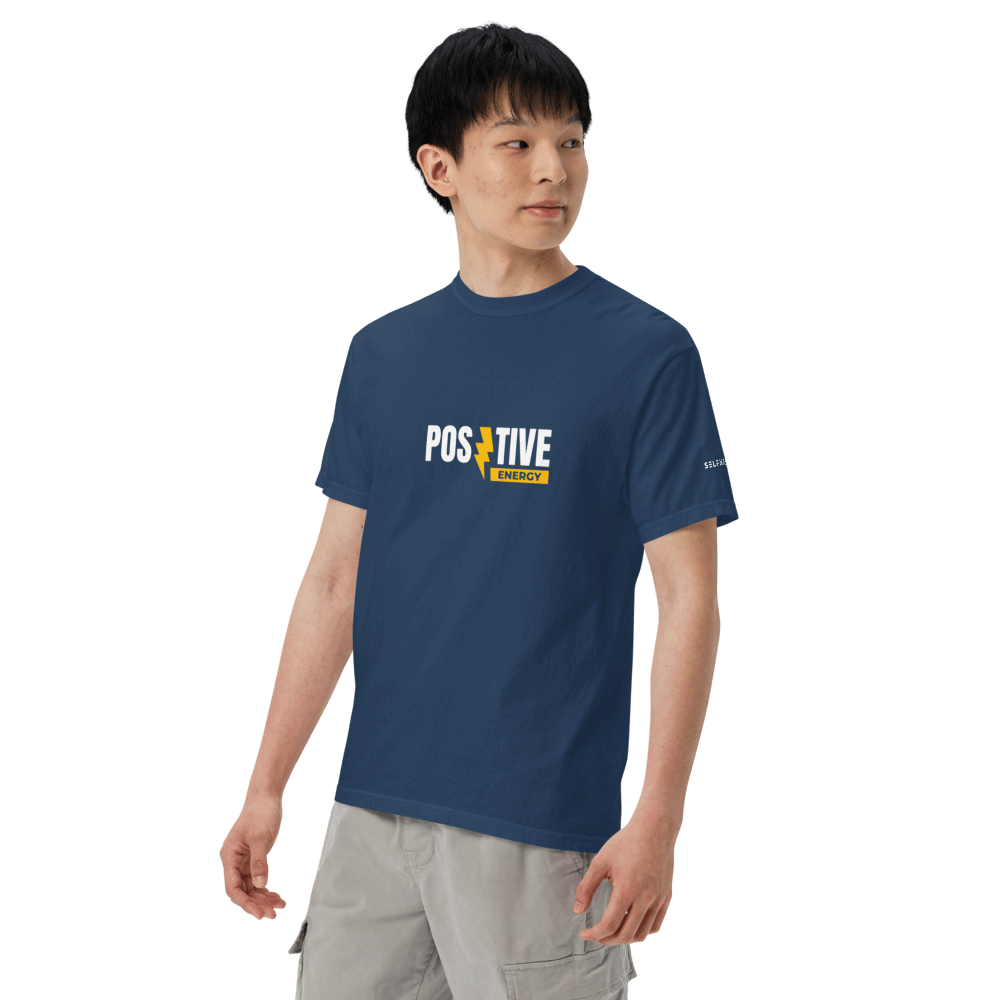 Model wearing Essential Positive Energy Tee in navy, showcasing premium organic cotton and versatile unisex style.