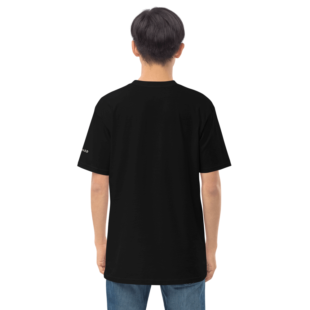 Back view of a model wearing a black Essential Hustle Tee made from 100% ring-spun cotton for ultimate comfort.