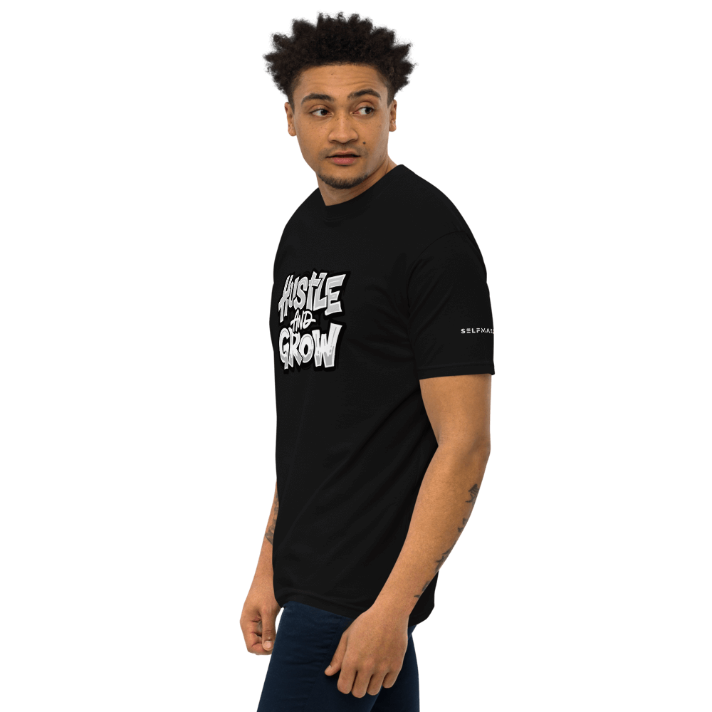 Man wearing Hustler's Tee in black, showcasing premium organic cotton apparel with a stylish fit.