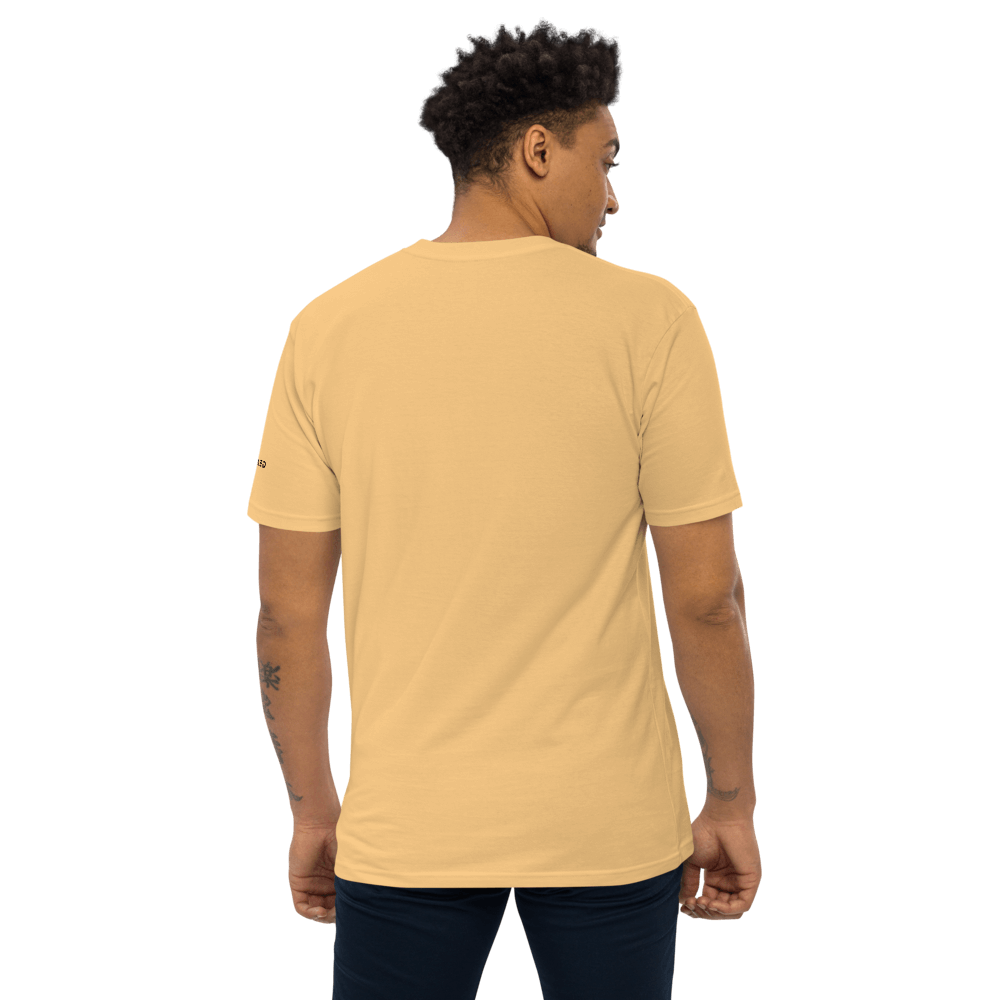 Back view of a man wearing an Essential Cotton Tee in a warm tone, showcasing its premium organic cotton design.