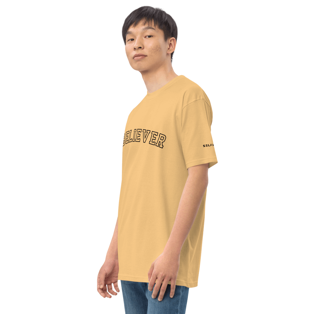 Essential yellow tee featuring 'BELIEVER' text, made from soft ring-spun cotton for a polished look.