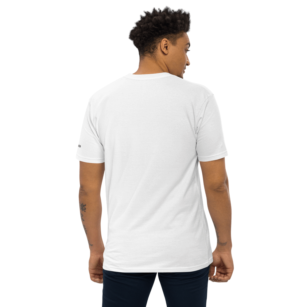 Model wearing an essential white tee, showcasing the back view and soft, durable fabric for stylish layering.