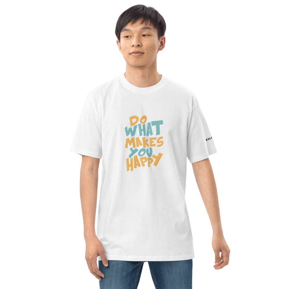 Model wearing a white tee with 'Do What Makes You Happy' graphic, showcasing casual and uplifting apparel.