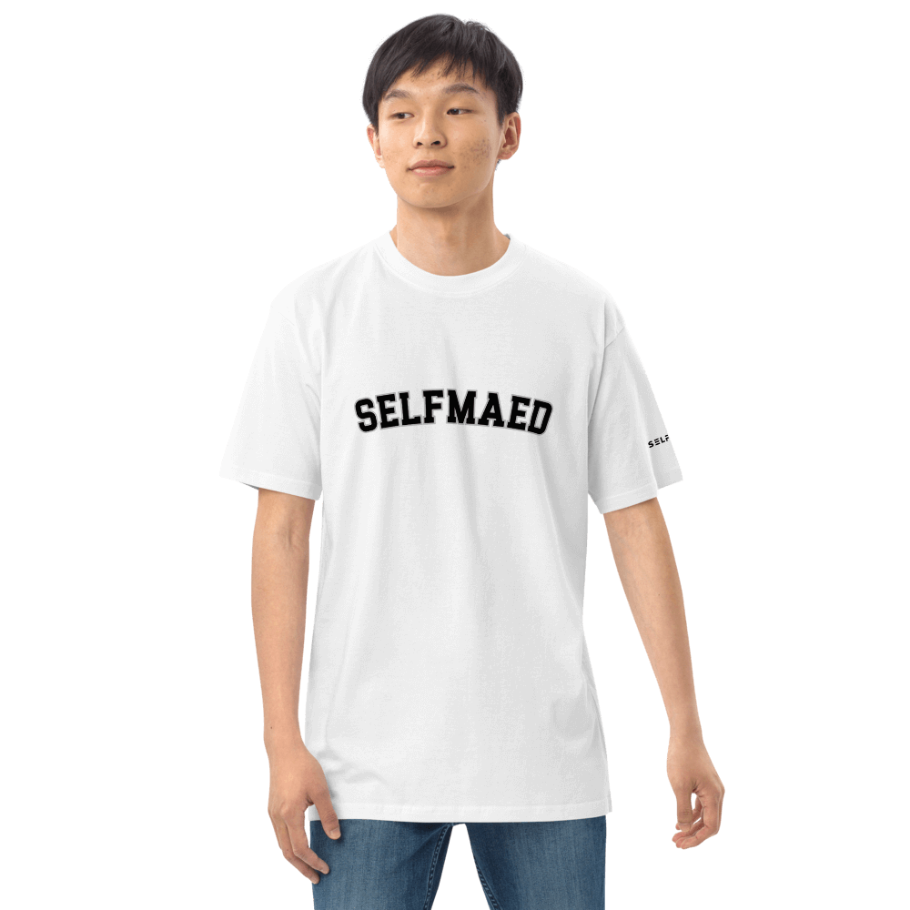 Model wearing Selfmaed Premium Tee in white, featuring bold black lettering, showcasing organic cotton apparel.