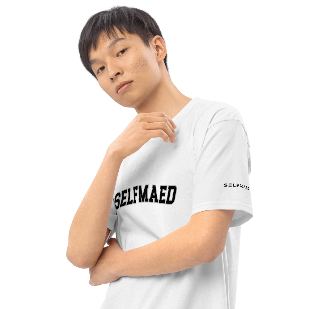 Model wearing Selfmaed Premium Tee in white, showcasing its stylish design and classic fit made from organic cotton.
