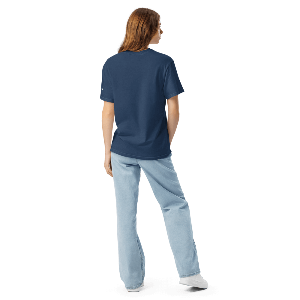 Back view of model wearing Essential Navy Selfmade Tee, showcasing its relaxed style and premium organic cotton fabric.